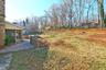 View of yard with a patio area and a sunroom