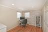 Home office with ornamental molding, light wood-style flooring, recessed lighting, and radiator heating unit