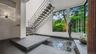 Entry Foyer is Graced By A Stainless Steel Floating Staircase