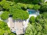 View of subject property featuring a pool area
