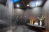 An Expansive Walk-in Steam Shower With Multiple Shower Heads