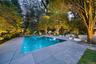 View of pool featuring a patio and a pool with connected hot tub