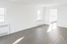 Spare room featuring radiator heating unit, wood finished floors, and a baseboard heating unit