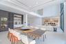 Formal dining with custom cabinetry a bar area.