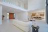 Modern living area with large glass slinding doors that offers a Panoramic view and access to an exterior area.
