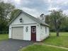 Detached garage featuring driveway