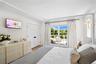 Bedroom with access to exterior, crown molding, a closet, and light wood-type flooring