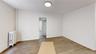 Spare room with radiator and light wood-style flooring