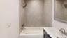 Full bath with washtub / shower combination and vanity