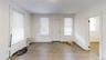 Entrance foyer with light wood-style flooring and radiator
