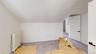 Additional living space with radiator, vaulted ceiling, and carpet