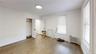Unfurnished bedroom featuring radiator, wood finished floors, and a closet