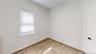 Empty room featuring light wood-type flooring and baseboards