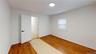 Spare room with light wood-type flooring and baseboards