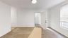 Spare room with light wood-type flooring and baseboards