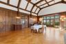Banquet sized dining room with leaded glass french doors to patio,  pocket doors to original entry foyer and kitchen access