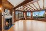Formal living room with hardwood floors and fireplace.  Overlooks backyard and Long Island sound