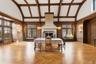 Banquet sized Dining room featuring high vaulted ceiling, old growth forest wood walls, plenty of original herringbone oak floors, tons natural light,