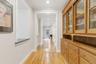 Entry Hall featuring ornamental molding,  wood floors, recessed lighting & a butler's pantry