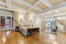 Bedroom with french doors, beamed coffered ceiling, sitting area, and ornamental molding, spectacular herringbone oak floors