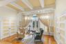 Sitting room featuring french doors with leaded glass accents, beamed ceiling