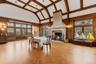 Banquet sized Dining room with high vaulted beamed ceilings, leaded glass windows with stained glass accents, original herringbone oak floors