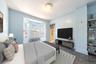 Bedroom featuring radiator heating unit and baseboards