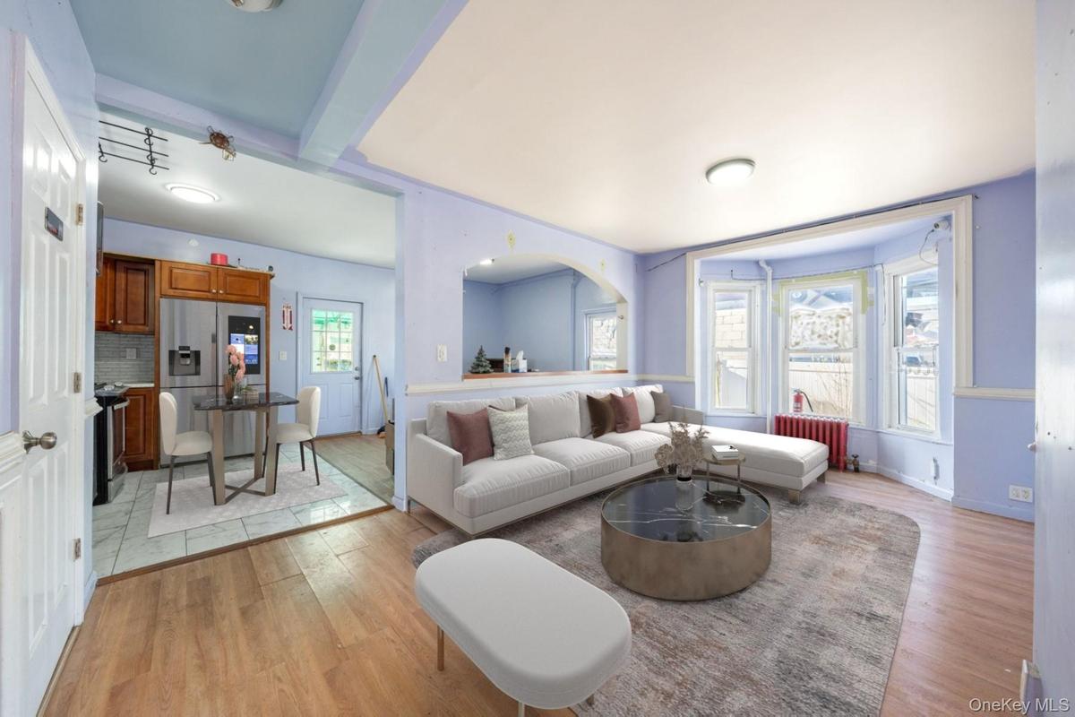 Living area with light wood-type flooring and baseboards