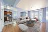 Living area with light wood-type flooring and baseboards