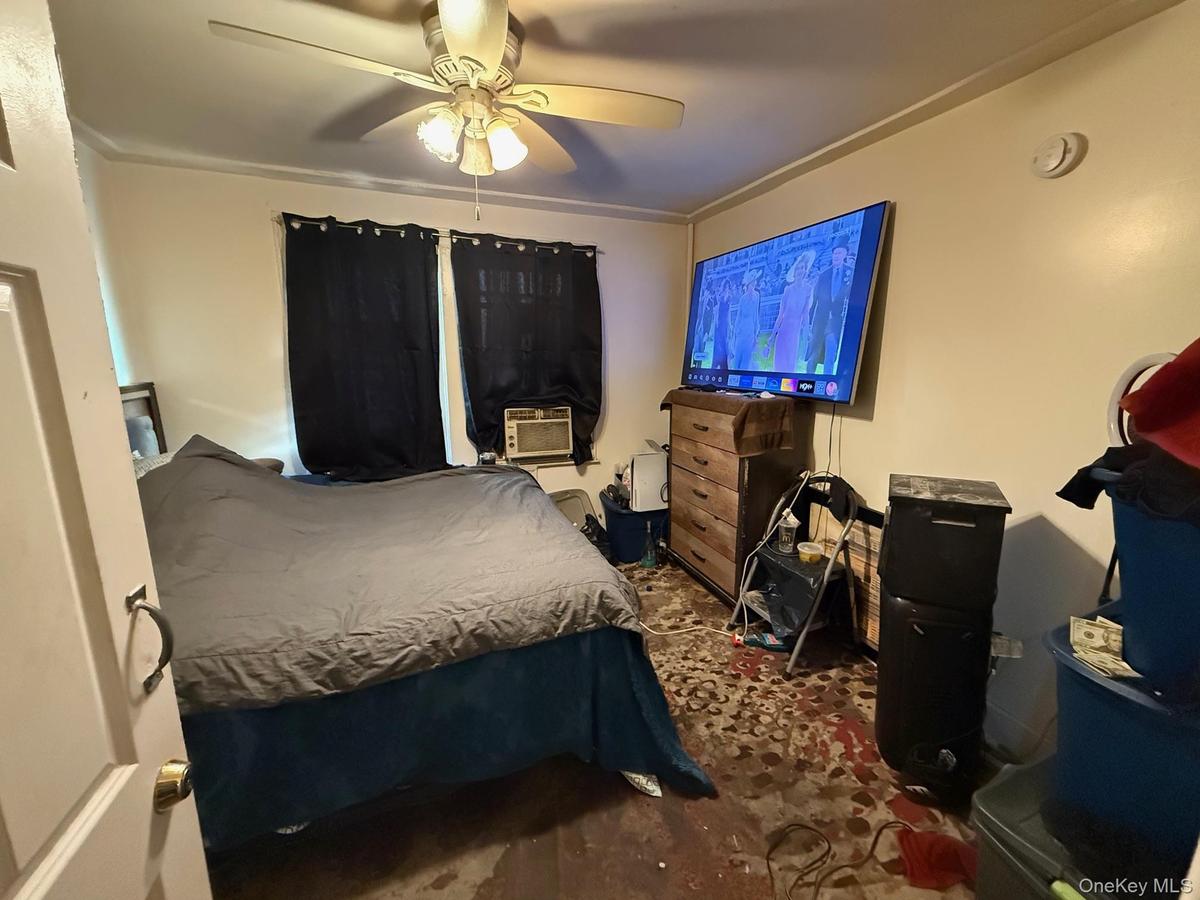 Bedroom featuring a ceiling fan