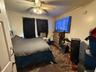 Bedroom featuring a ceiling fan