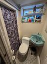 Full bath featuring a shower with shower curtain and vanity