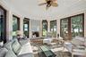 Sunroom / solarium with a decorative wall