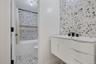 Full bathroom featuring vanity and shower / tub combo