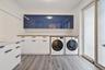 Laundry room featuring washer and clothes dryer and light wood-type flooring