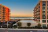 View of apartment building / complex with a water view