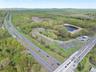 Drone / aerial view featuring a water view and a view of trees