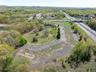 Birds eye view of property featuring a view of trees and a water view