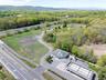 Birds eye view of property featuring a view of trees