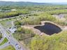 Bird's eye view with a water and mountain view and a forest view
