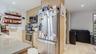 Kitchen featuring stainless steel appliances, light brown cabinets, recessed lighting, decorative backsplash, and open shelves
