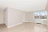 Unfurnished room with radiator heating unit and light wood-style flooring