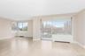 Unfurnished room featuring radiator heating unit and light wood-type flooring