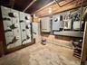 Unfinished below grade area with electric panel