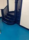 Stairs with baseboards and finished concrete flooring