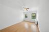Spare room with light wood-style flooring and ceiling fan