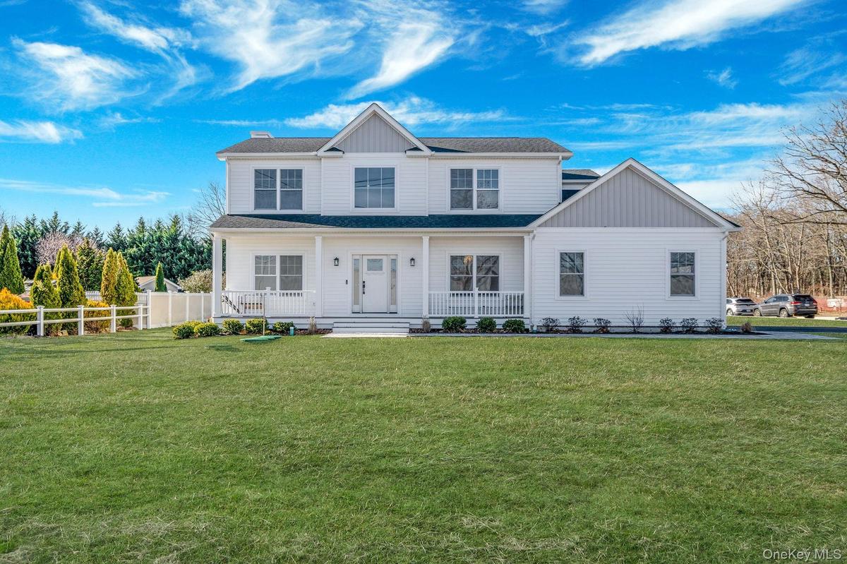 View of front of property with covered porch, roof with shingles, and board and batten siding. For Marketing Purposes!