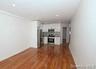 Unfurnished living room with dark wood finished floors and recessed lighting