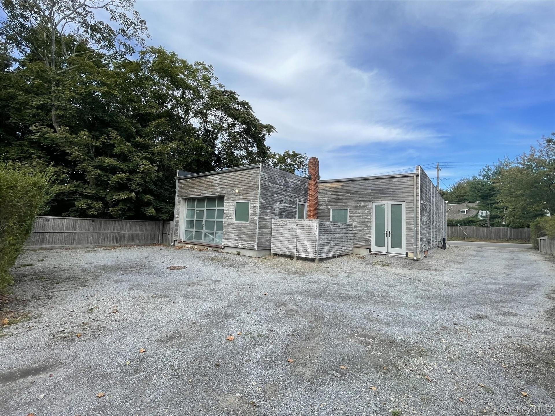 Back of house featuring french doors and a chimney