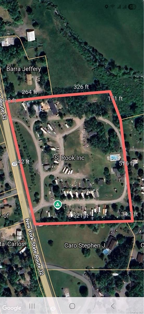 Aerial overview of property's location featuring property parcel outlined